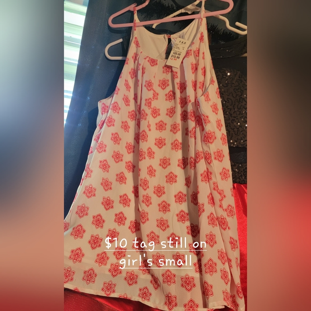 Girl's small shirt tag still on.